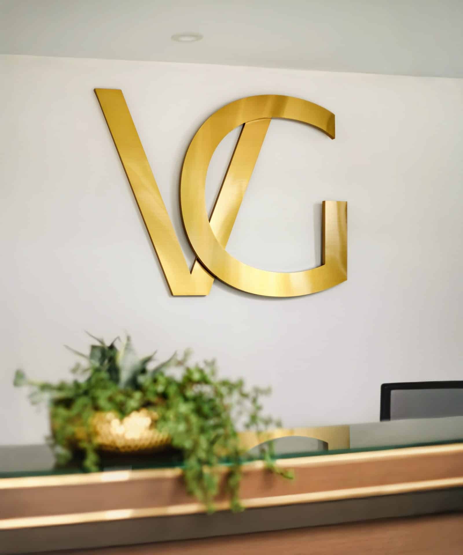 vg-signature-logo-reception-desk-tampa-plastic-surgery-branding