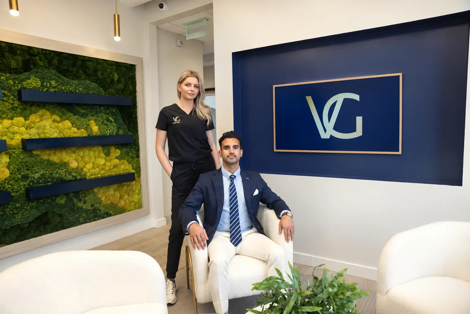 Dr. Vipul Gargya, board-certified plastic surgeon, seated in the VG Signature luxury plastic surgery office in Tampa, Florida